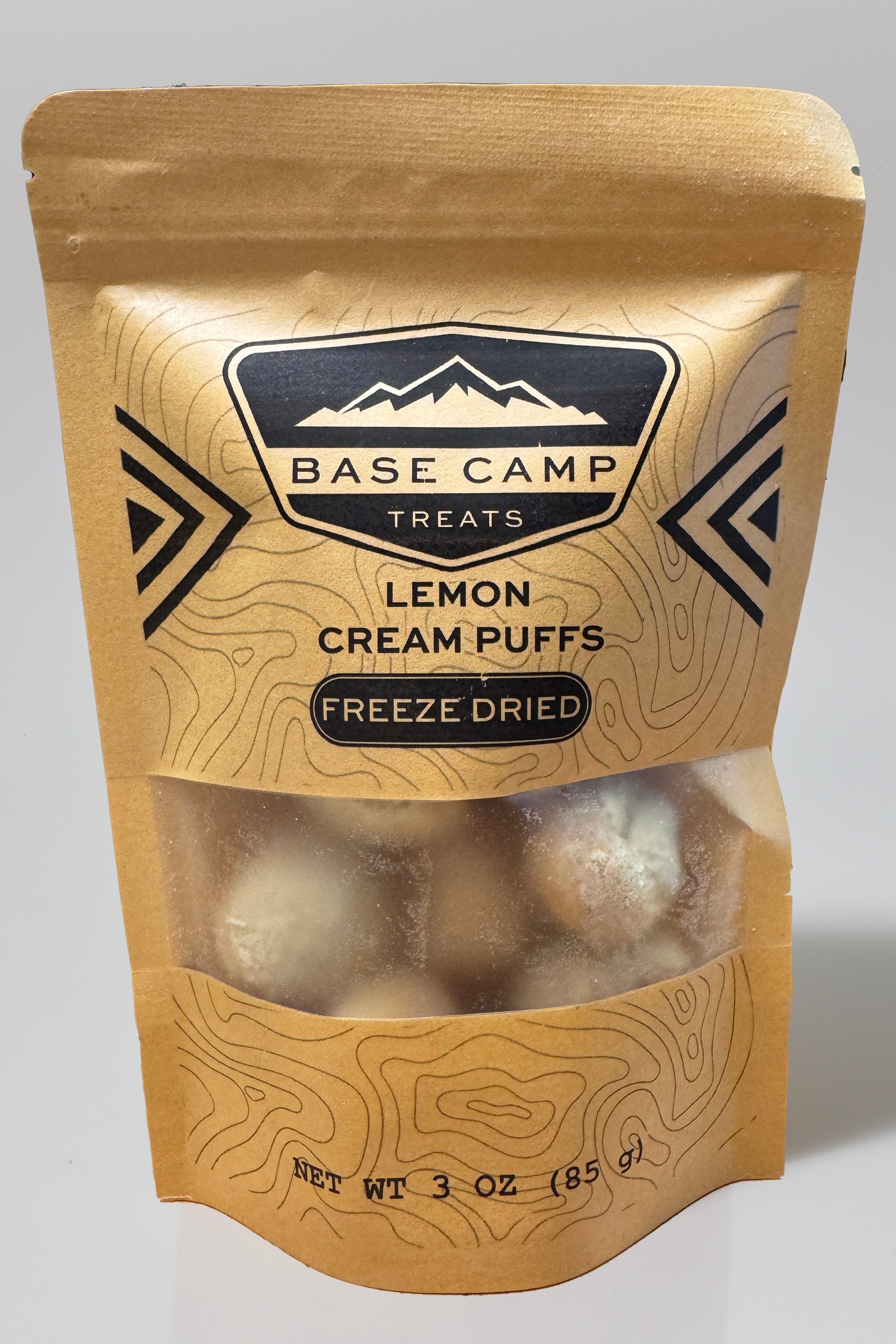 Base Camp Treats Freeze Dried Lemon Cream Puffs in a kraft bag on a  white background