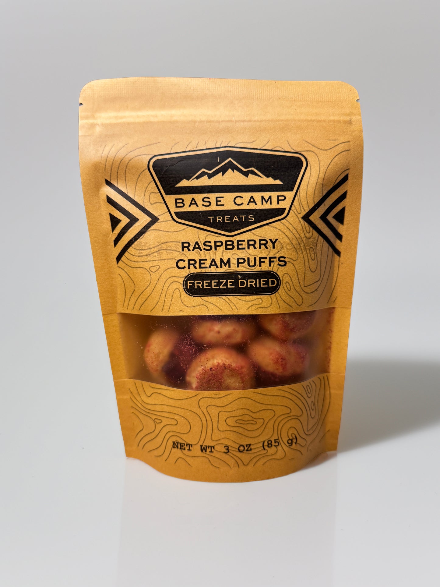Base Camp Treats Freeze Dried Raspberry Cream Puffs in a Kraft Bag on a  white background