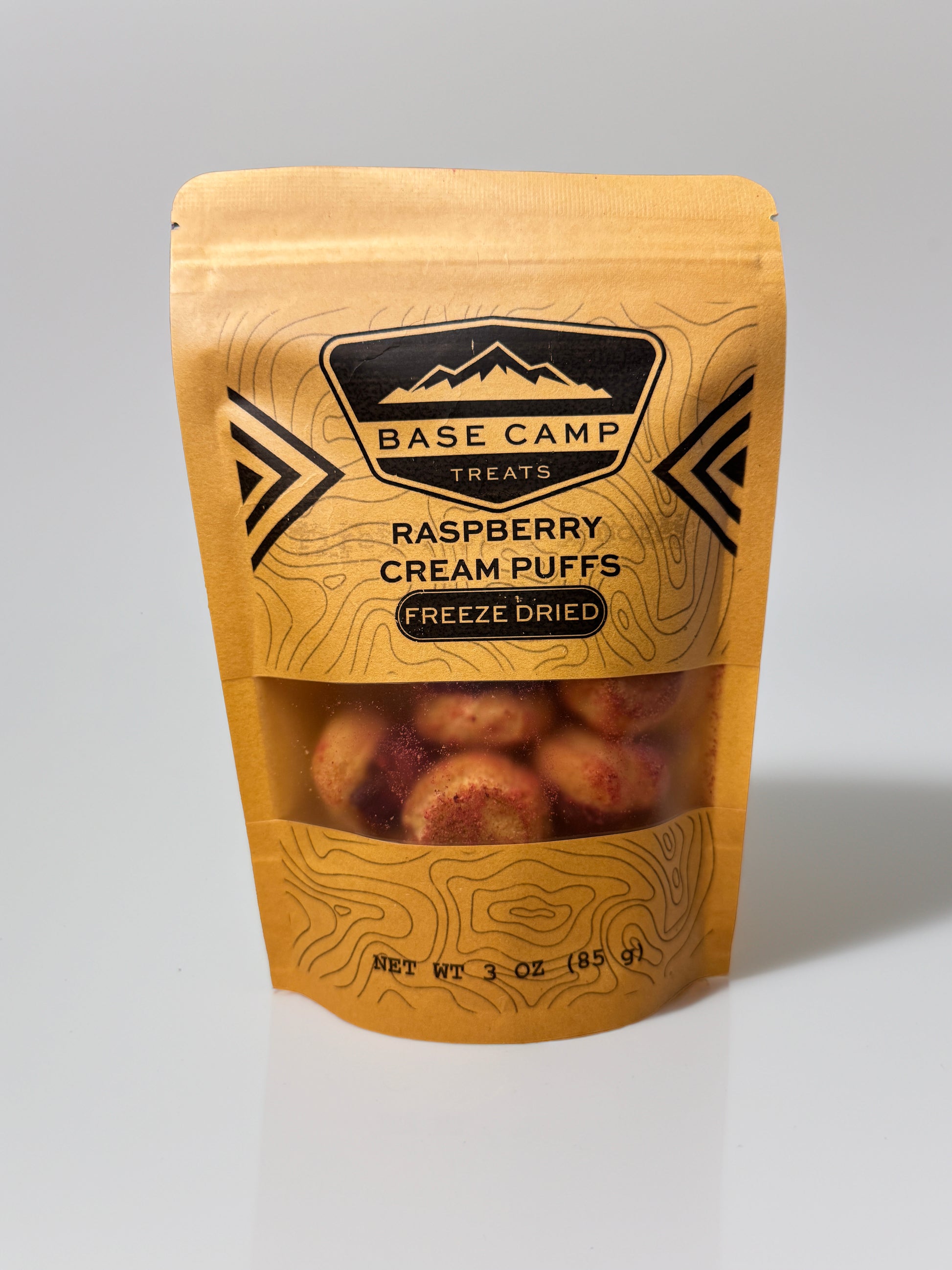 Base Camp Treats Freeze Dried Raspberry Cream Puffs in a Kraft Bag on a  white background