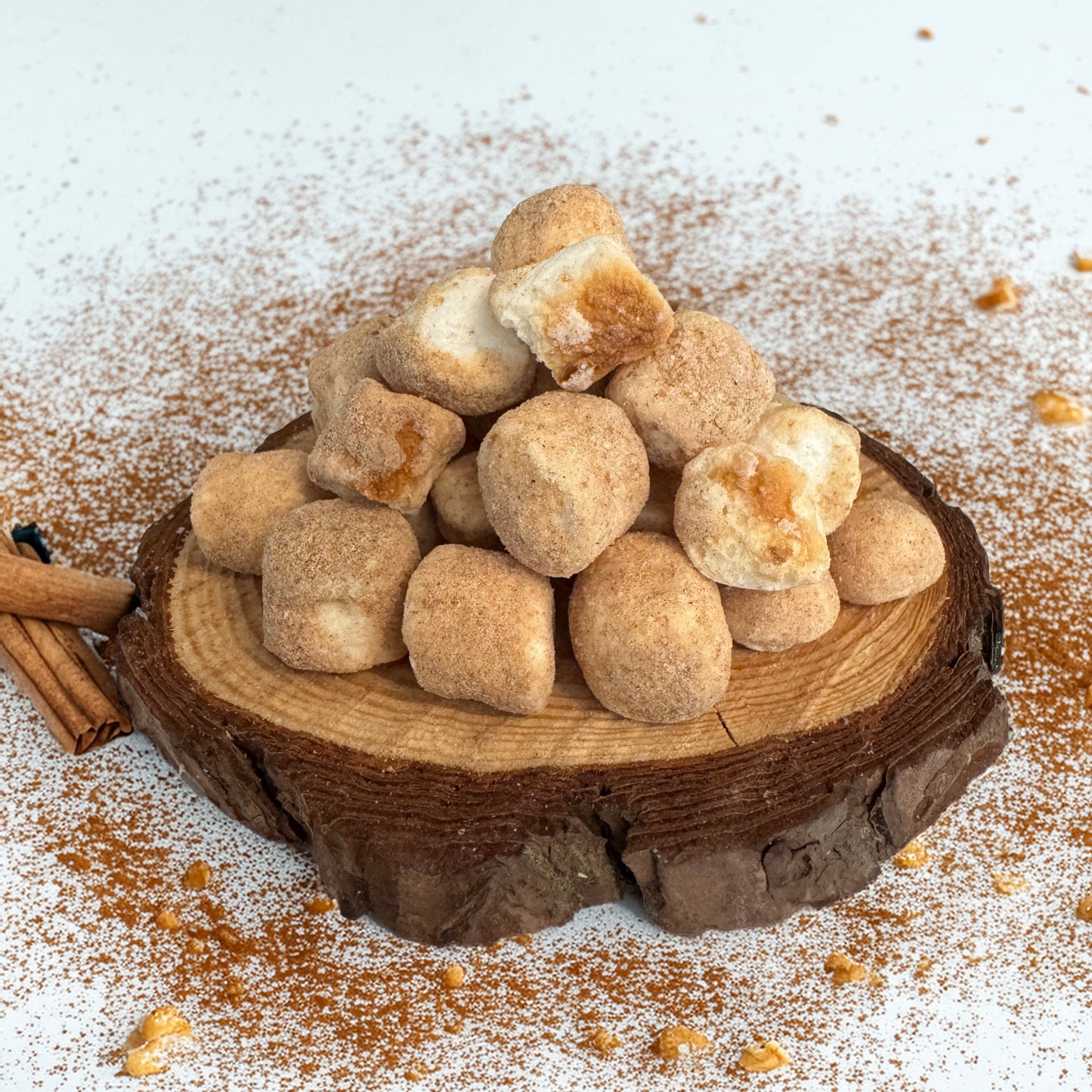 Base Camp Treats Freeze Dried Churro S'mores on a wooden coaster on a  white background