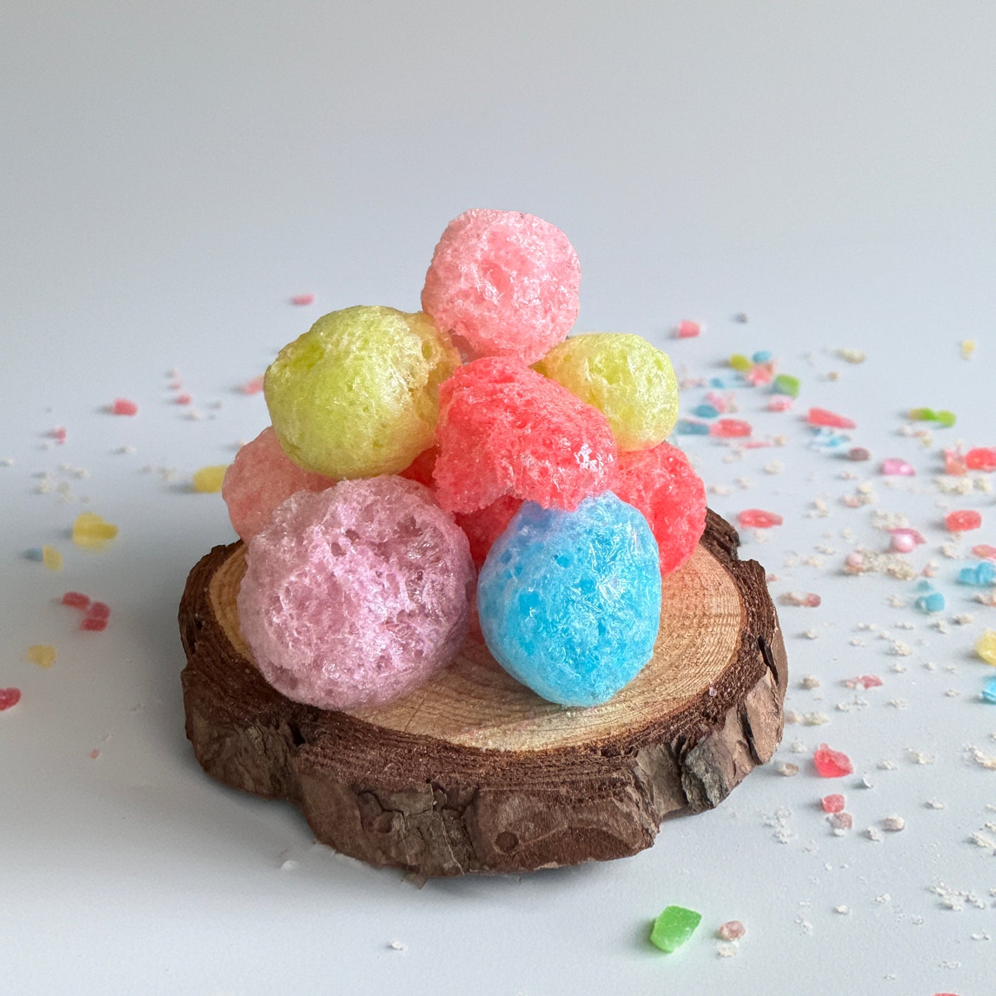 Base Camp Treats Jolly Puffs Freeze Dried Jolly Rancher on a wood disk with a white background