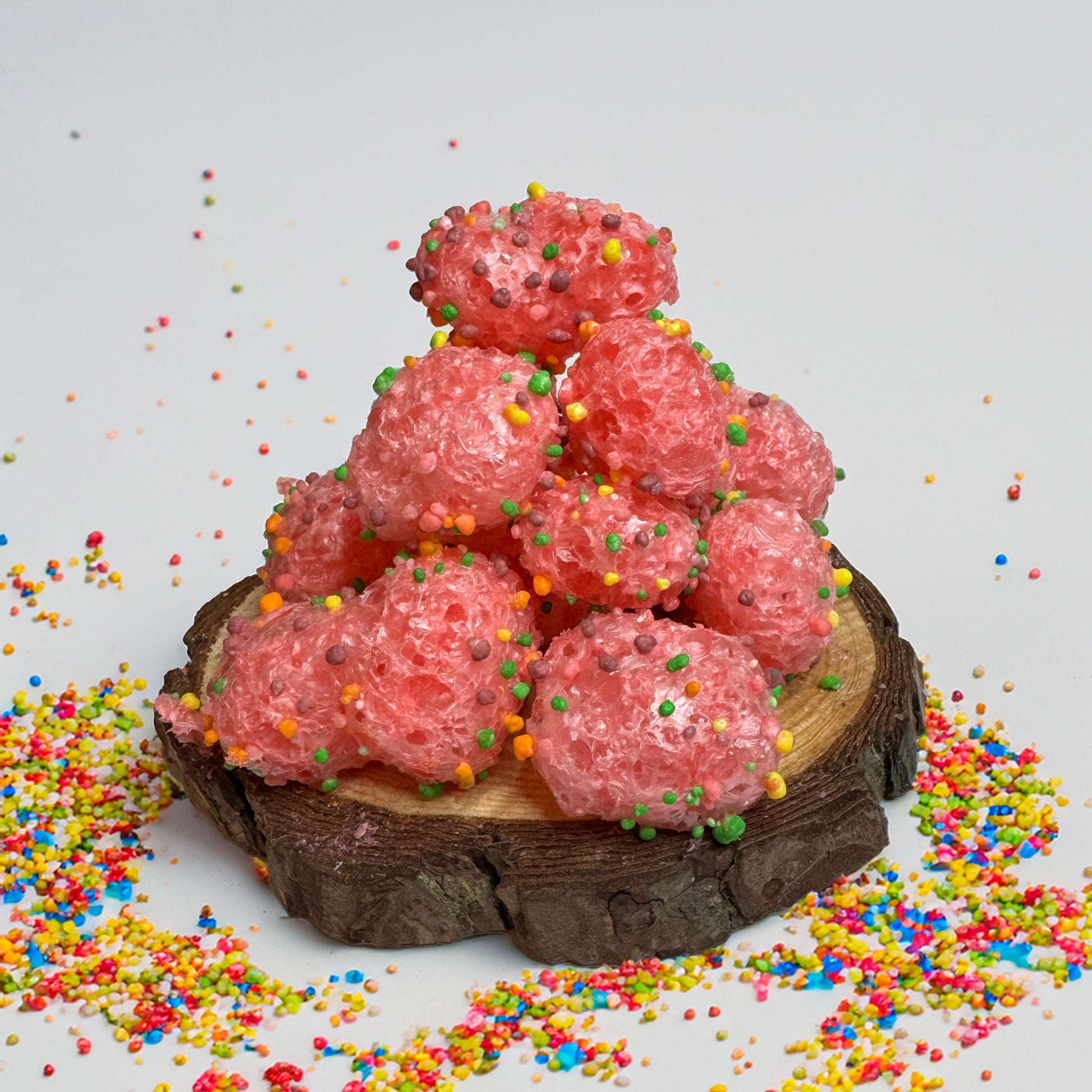 Base Camp Treats Geek Clusters Freeze Dried Nerd Gummy Clusters on a wooden disk with a white background